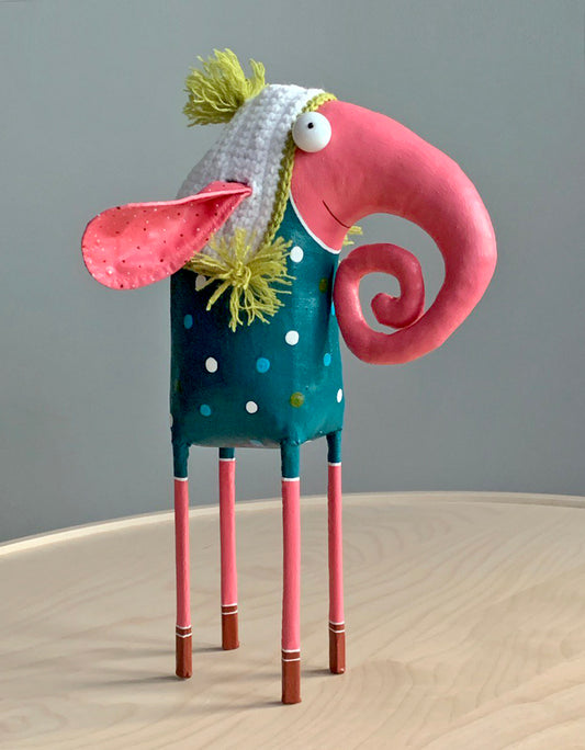 Elephant in a knitted hat , interior toy